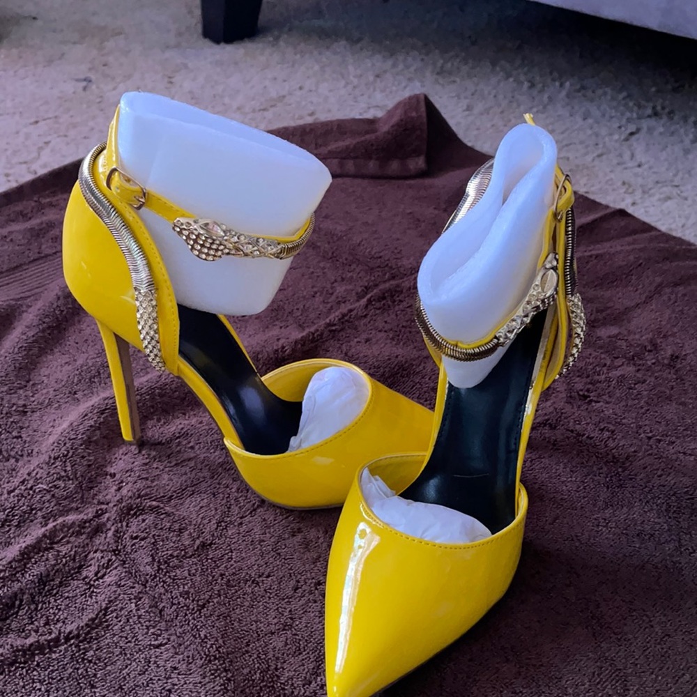 Neon yellow colored high heels. Been worn once. Still in box.